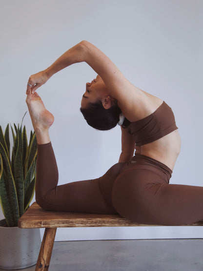 yoga pose, back bend in brown yoga set